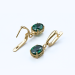 Chic 18k Gold Vermeil Emerald Earrings with vibrant created green gemstones, perfect for adding glamour to any look.