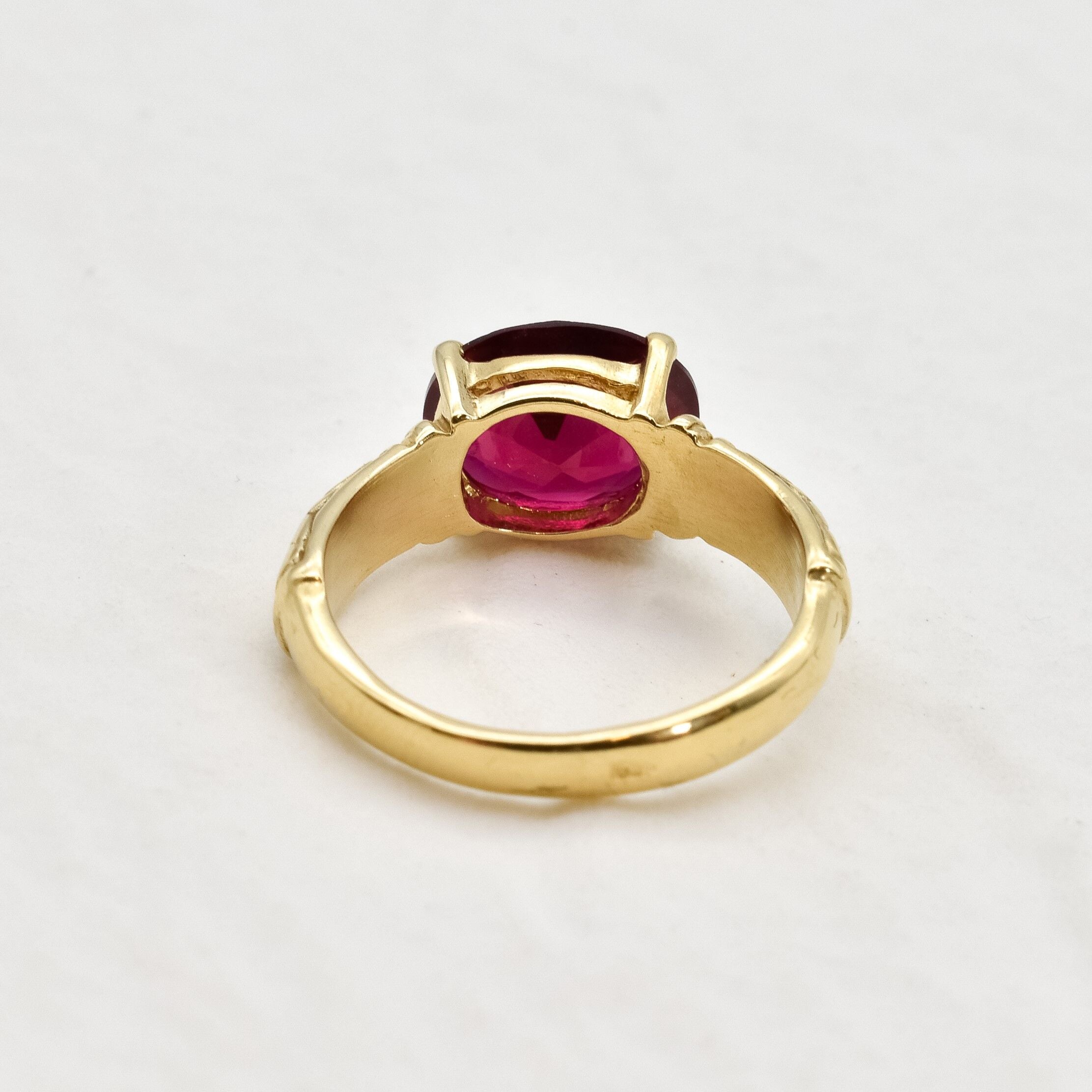 Sophisticated 18k Gold Vermeil Ruby Ring with a vibrant oval created ruby, a timeless accessory for any occasion.