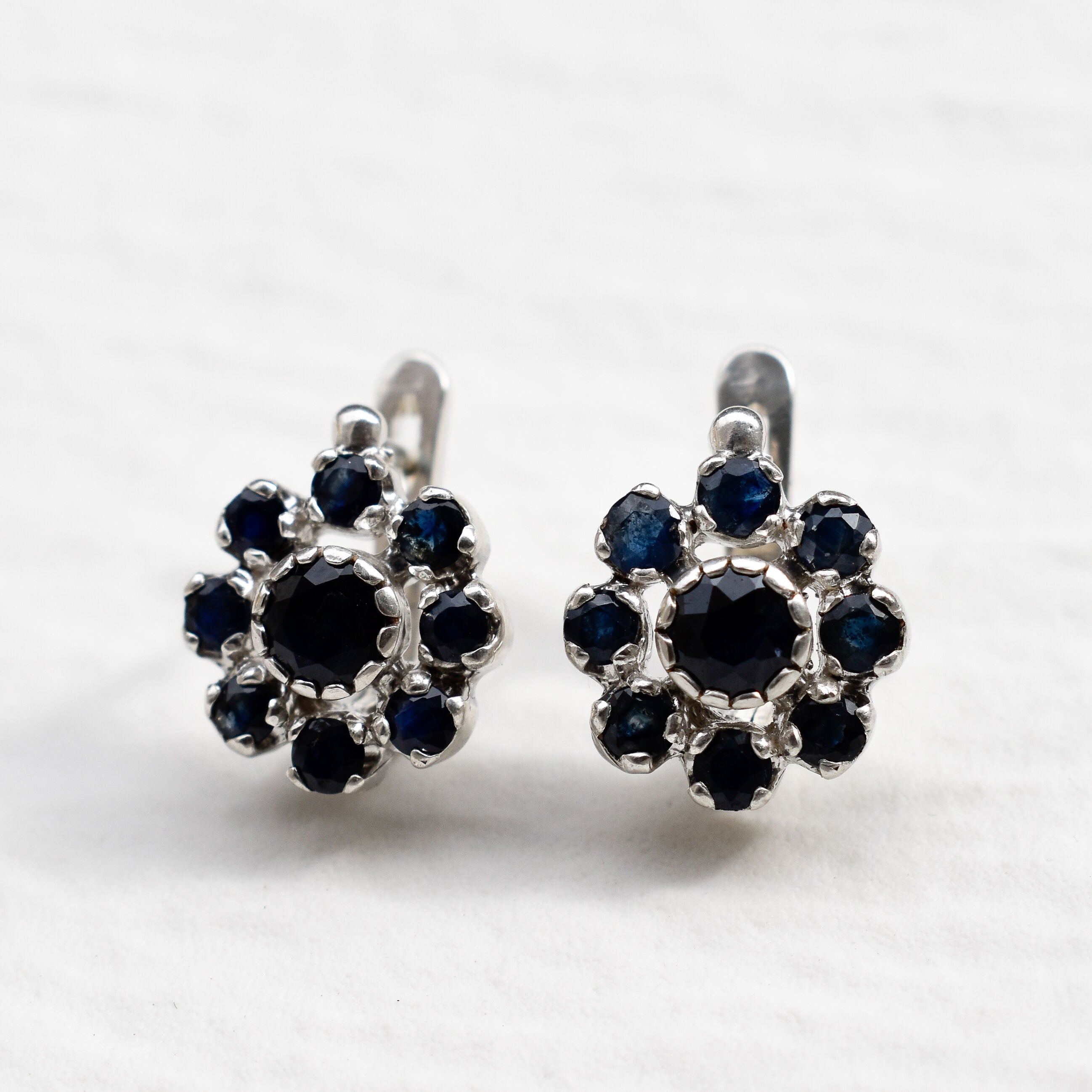 Sapphire Flower Earrings - Blue Floral Earrings - Silver Daisy Studs made in 925 Sterling Silver. Ideal for everyday wear and perfect for birthday gifting and special occasions.