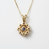 Delicate Blue Sapphire Flower Pendant in luxurious 18k Gold Vermeil, a beautiful choice for any occasion or gift.