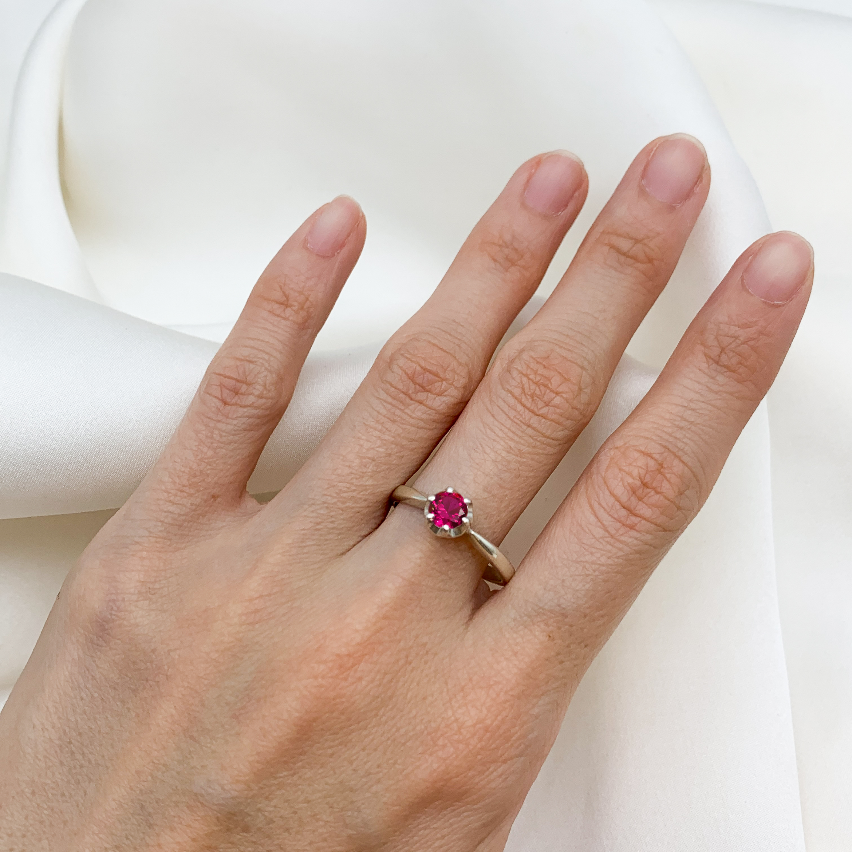 Dazzling Created Ruby and Silver Ring, perfect for those born in July, symbolizing passion and sophistication.
