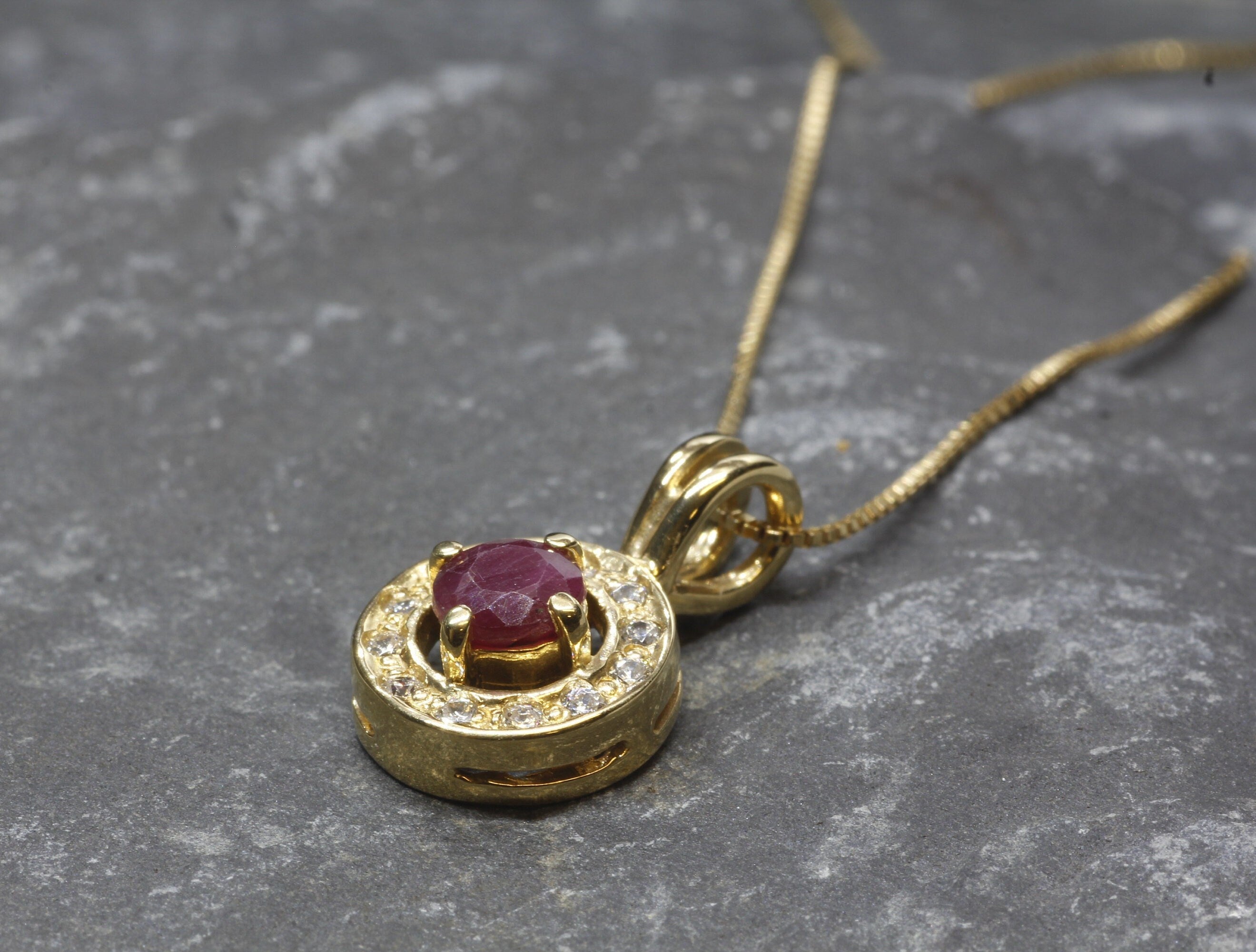 Natural Ruby Pendant made in 18k Gold Vermeil with Round Natural Red Ruby in Halo setting, July Birthstone gift idea, symbolizes nobility, purity, and passion, ideal for everyday wear and perfect for birthday gifting and special occasions.