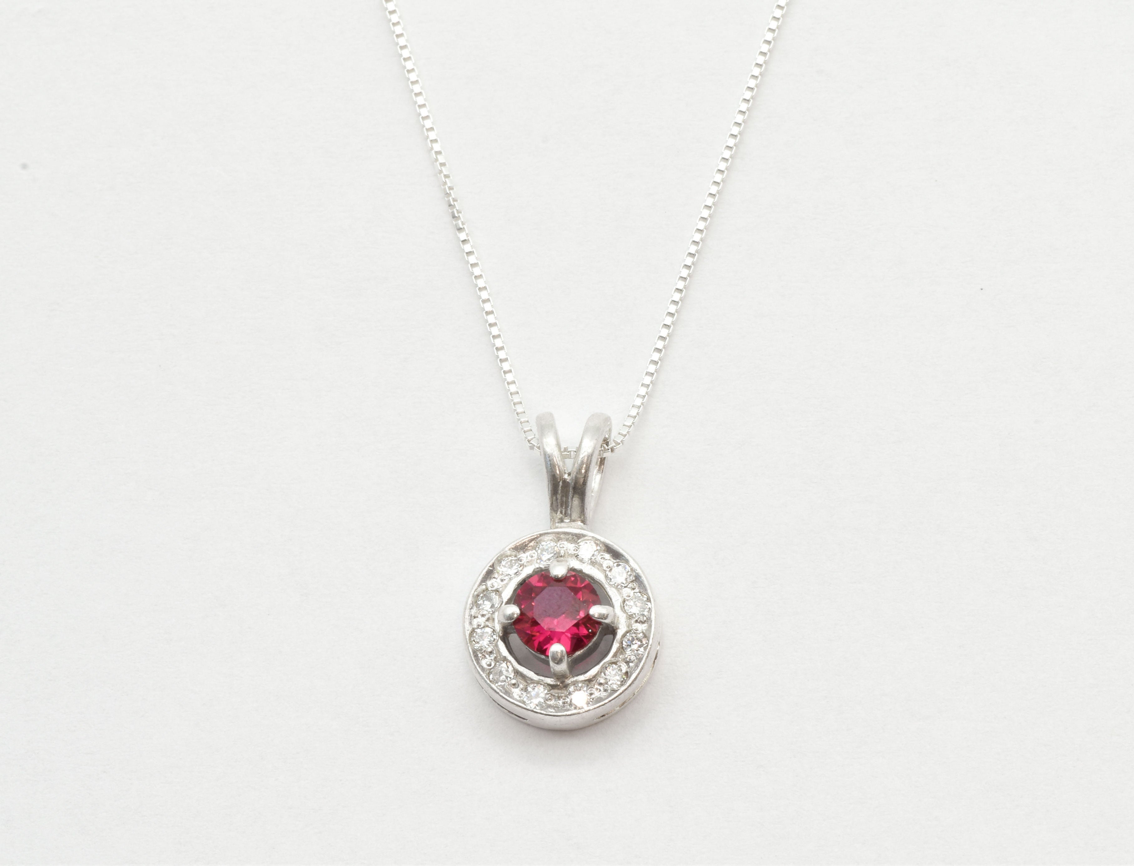 Created Ruby Pendant made in 925 Sterling Silver with Round Created Red Ruby in Halo setting, July Birthstone gift idea, symbolizes nobility, purity, and passion, ideal for everyday wear and perfect for birthday gifting and special occasions.