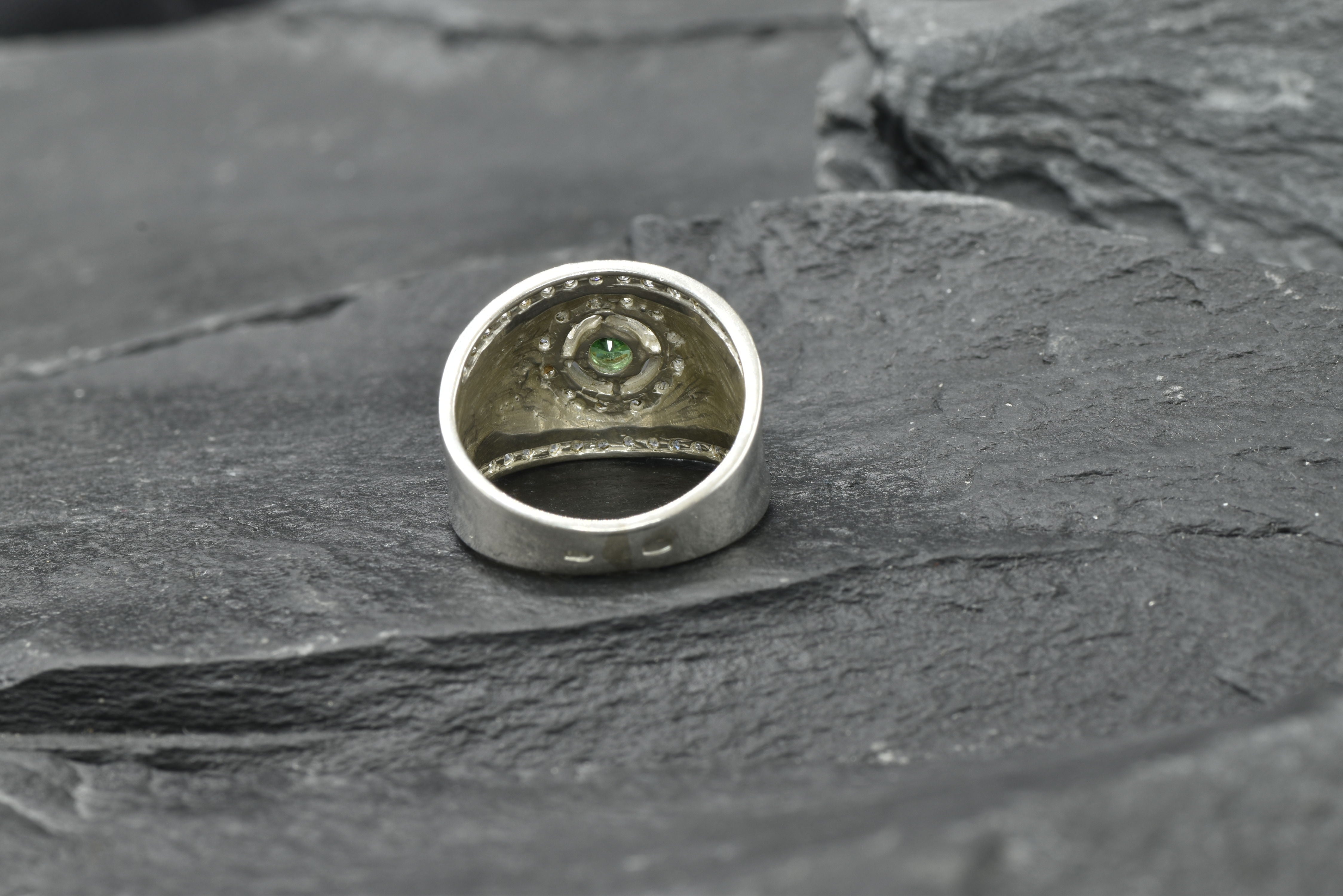 Dazzling 925 Sterling Silver halo ring with a Round Created Green Emerald, a meaningful May birthstone gift for loved ones.