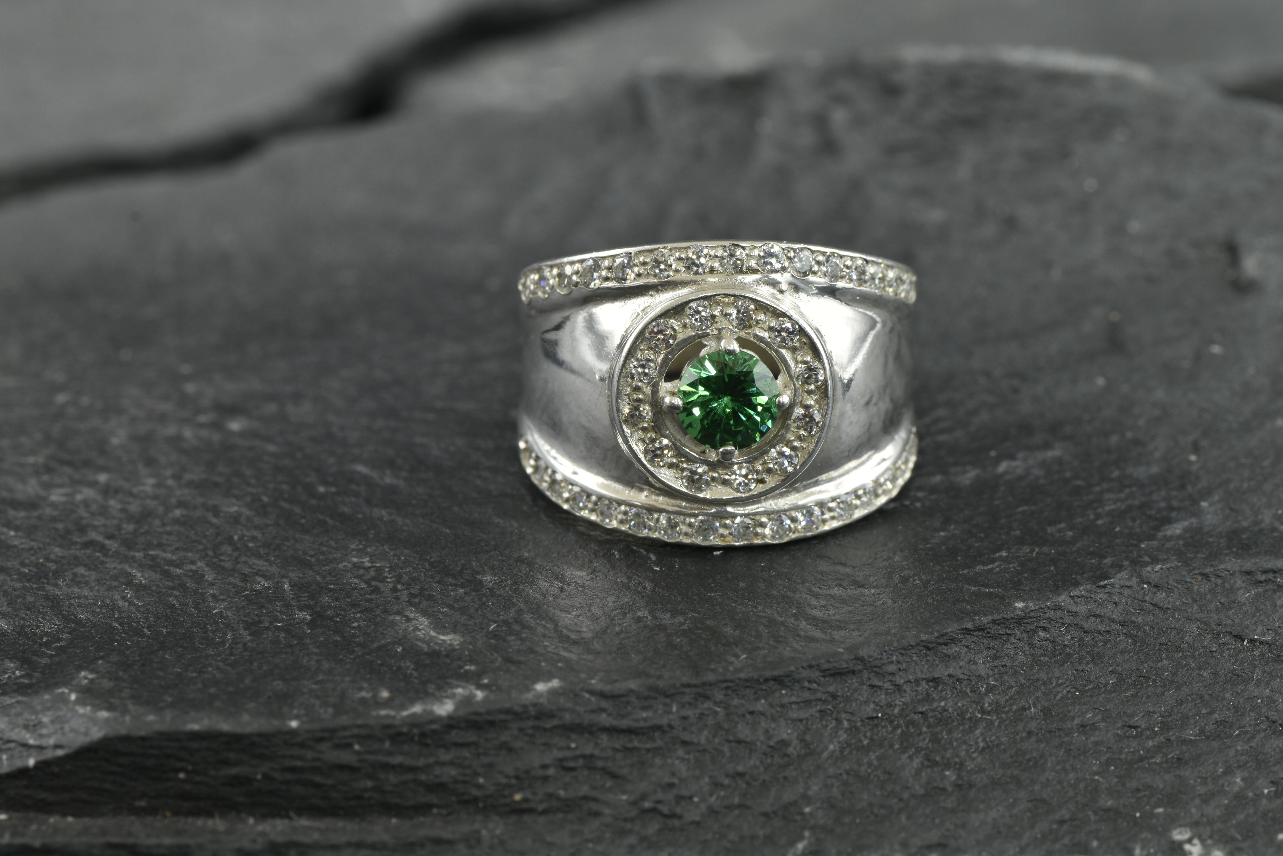 Beautifully crafted 925 Sterling Silver ring showcasing a Round Created Green Emerald, ideal for special occasions and May birthdays.