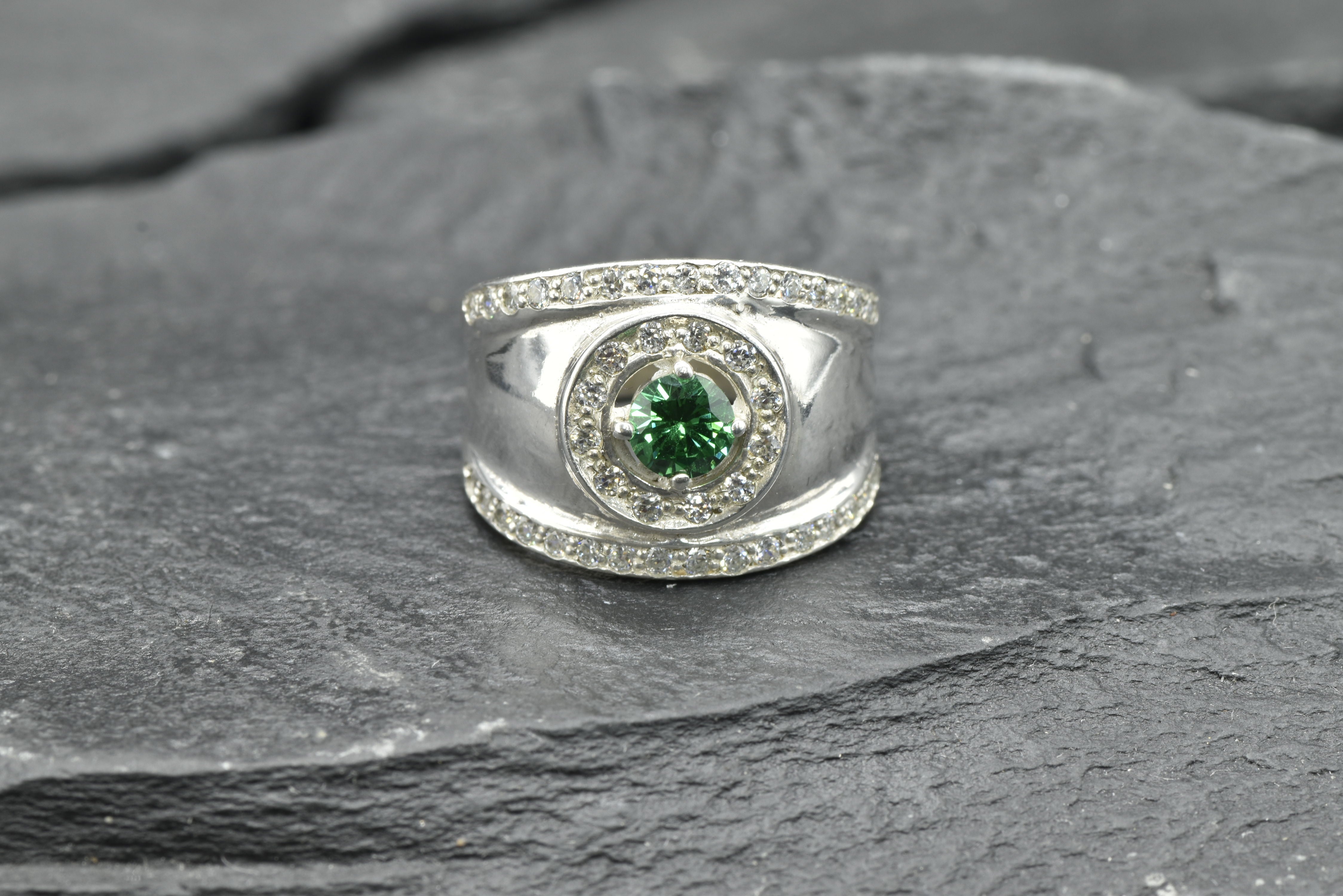 Delicate 925 Sterling Silver ring with a Round Created Green Emerald, ideal for birthdays and brings a touch of elegance.