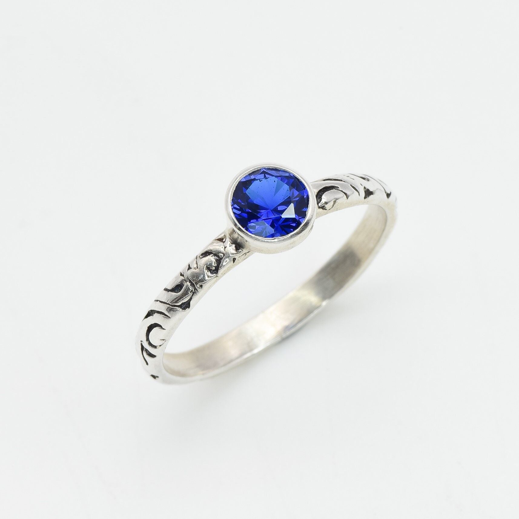 Created Sapphire Ring made in 925 Sterling Silver with Round Created Blue Sapphire in Bezel setting, September Birthstone gift idea, symbolizes sincerity, truth, and faithfulness, ideal for everyday wear and perfect for birthday gifting and special occasions.