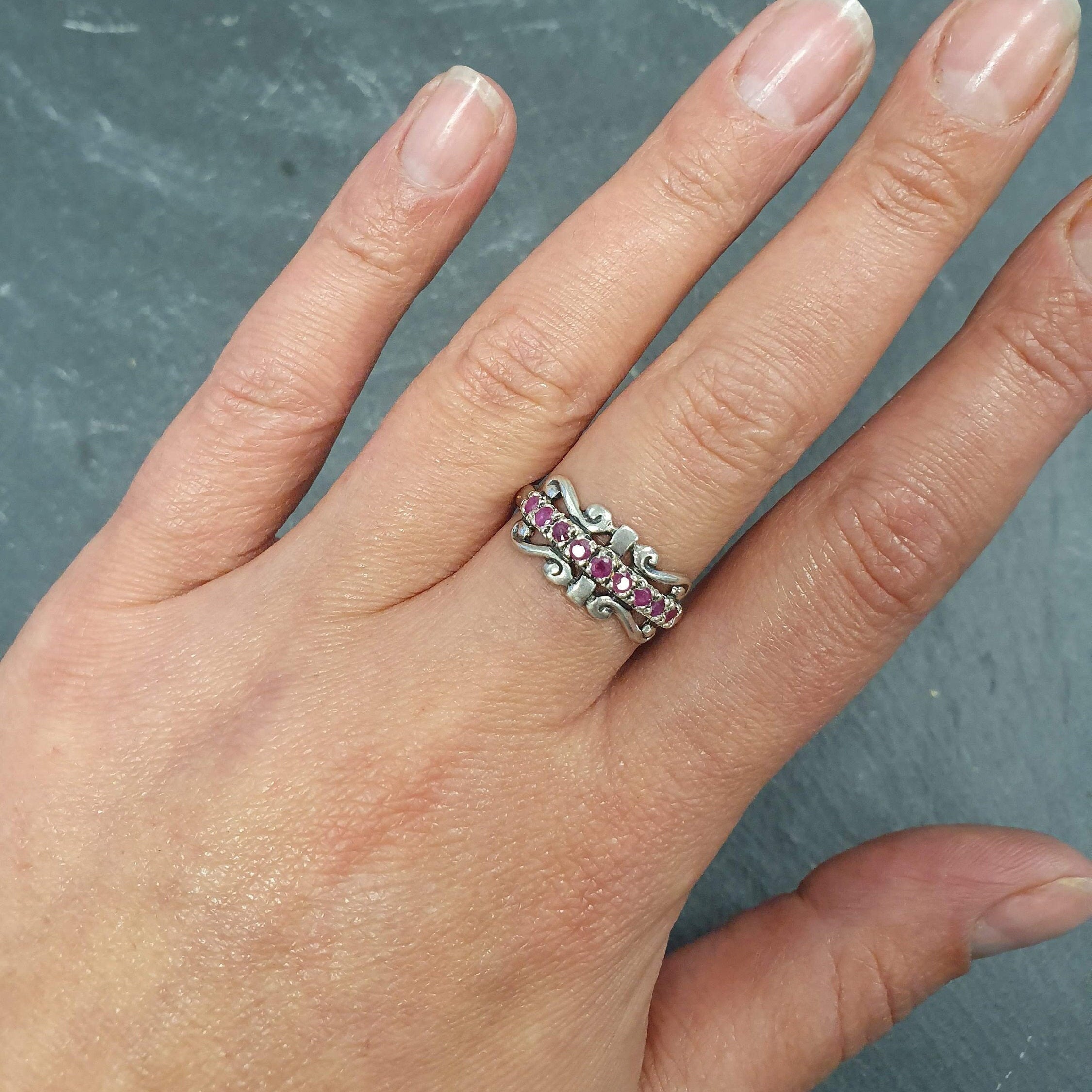 Elegant 925 Sterling Silver ring featuring a round natural red ruby, perfect for July birthdays and special occasions.