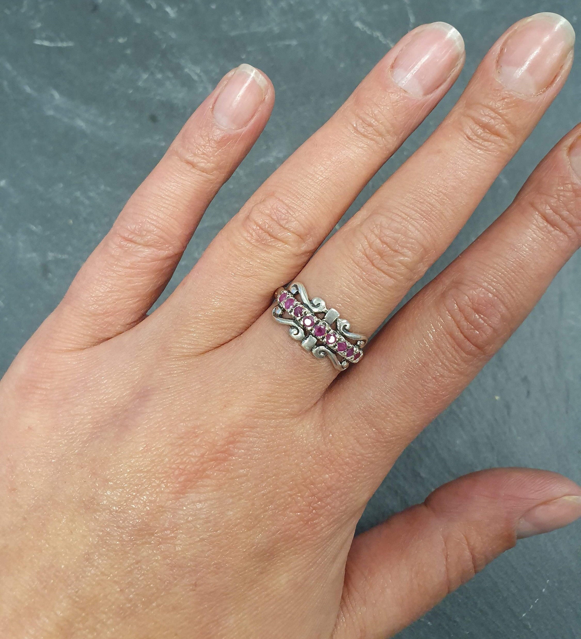 Elegant 925 Sterling Silver ring featuring a round natural red ruby, perfect for July birthdays and special occasions.