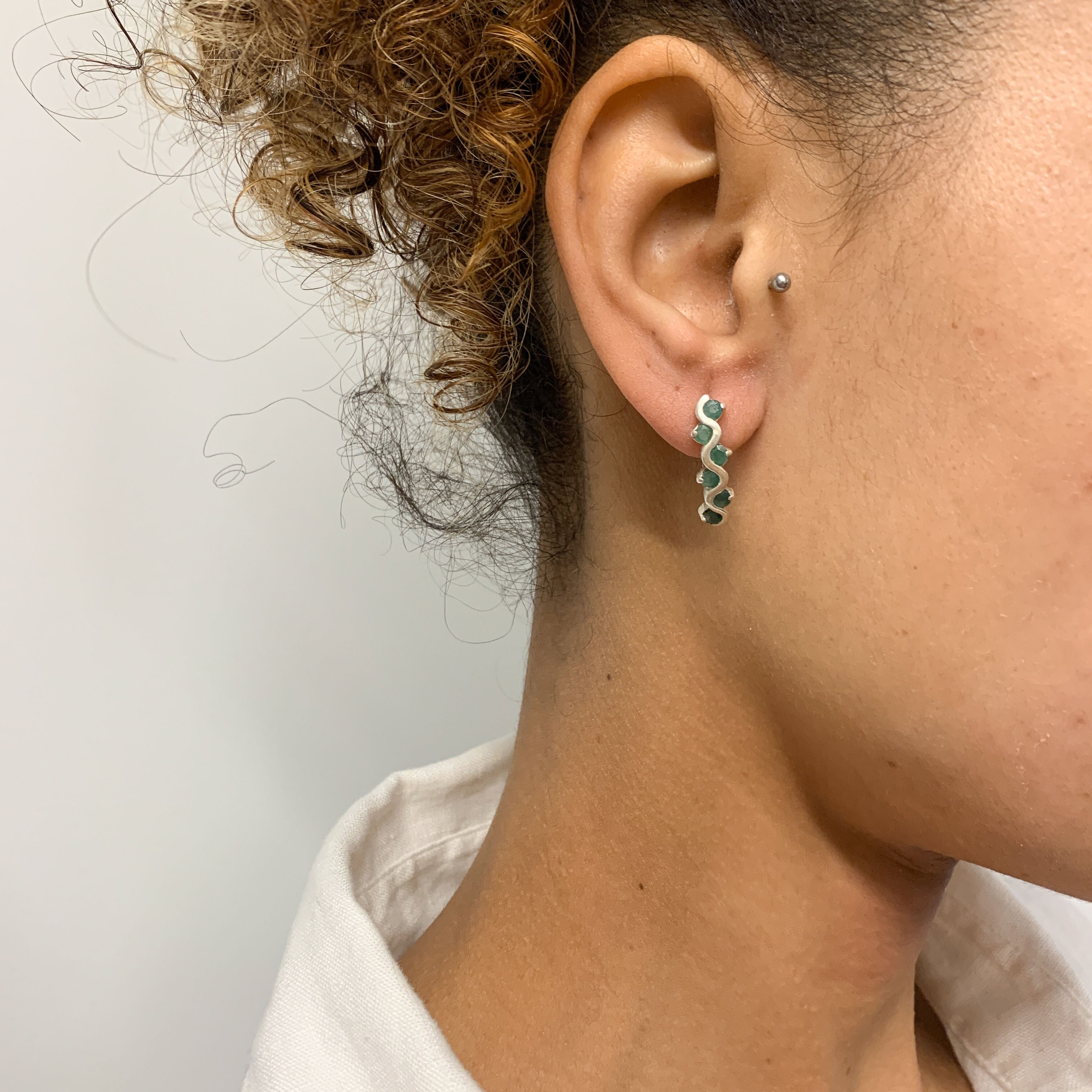 Elegant 925 Sterling Silver Natural Emerald Earrings with a stunning channel-set design, perfect for May birthdays and special occasions.