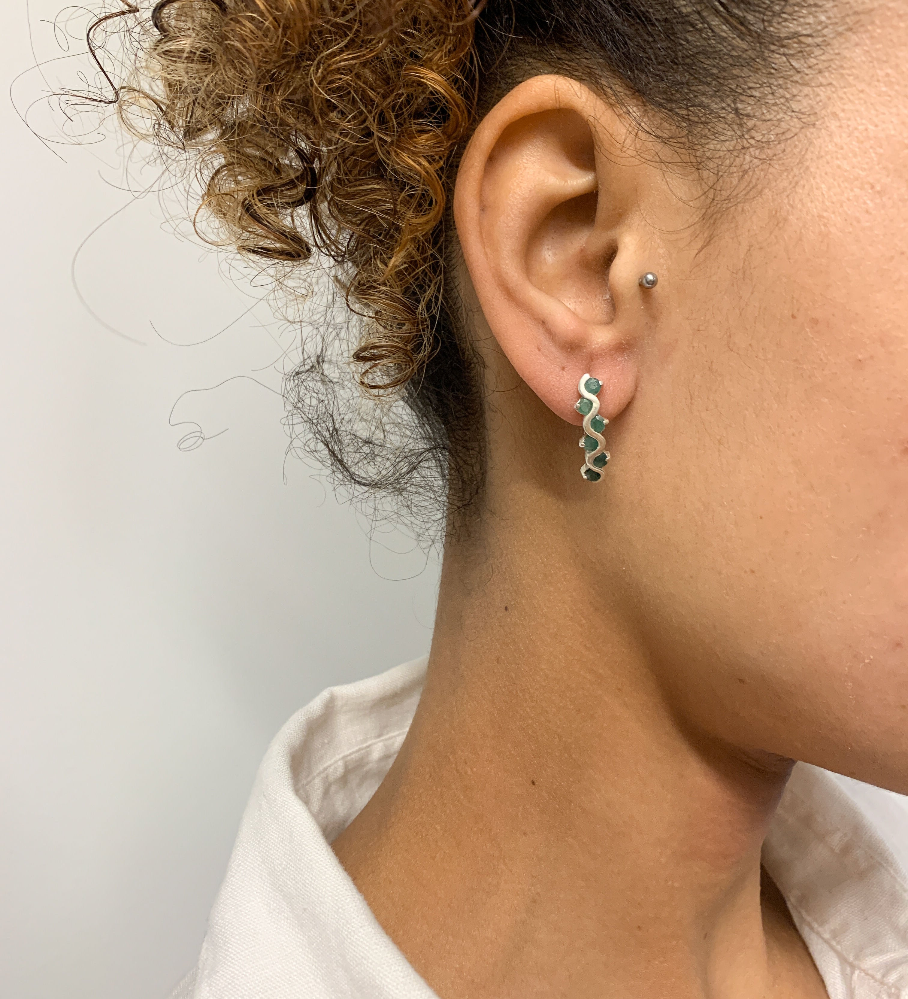 Elegant 925 Sterling Silver Natural Emerald Earrings with a stunning channel-set design, perfect for May birthdays and special occasions.