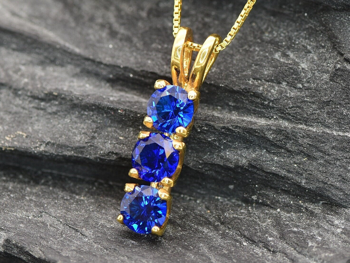 Created Sapphire Pendant made in 18k Gold Vermeil with Round Created Blue Sapphire in Three-Stone setting, September Birthstone gift idea, symbolizes sincerity, truth, and faithfulness, ideal for everyday wear and perfect for birthday gifting and special occasions.