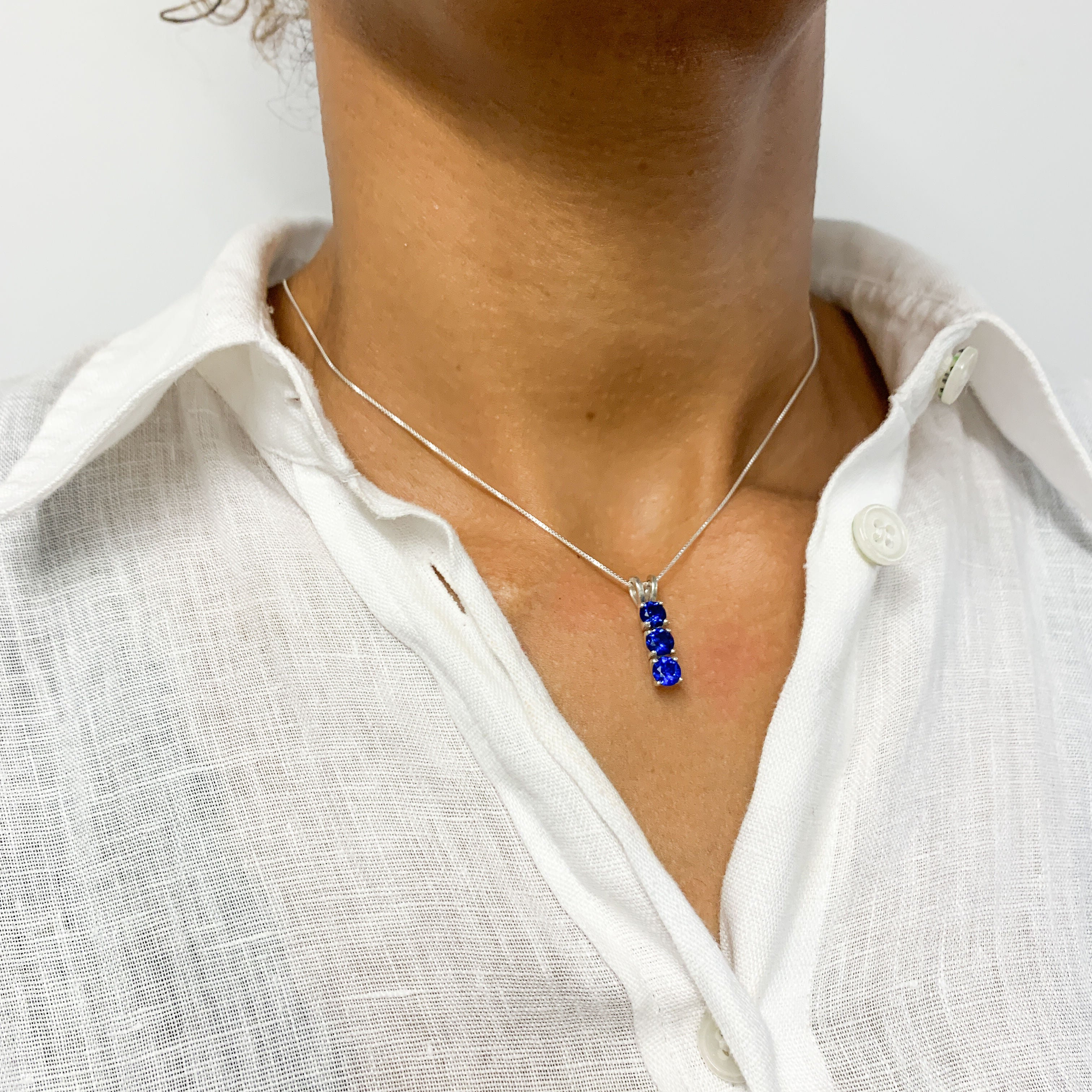 Elegant 925 Sterling Silver Sapphire Pendant in Three-Stone setting, ideal for September birthdays and meaningful gifts.
