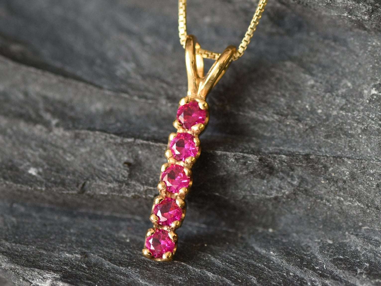 Created Ruby Pendant made in 18k Gold Vermeil with Round Created Red Ruby in Channel-Set setting, July Birthstone gift idea, symbolizes nobility, purity, and passion, ideal for everyday wear and perfect for birthday gifting and special occasions.