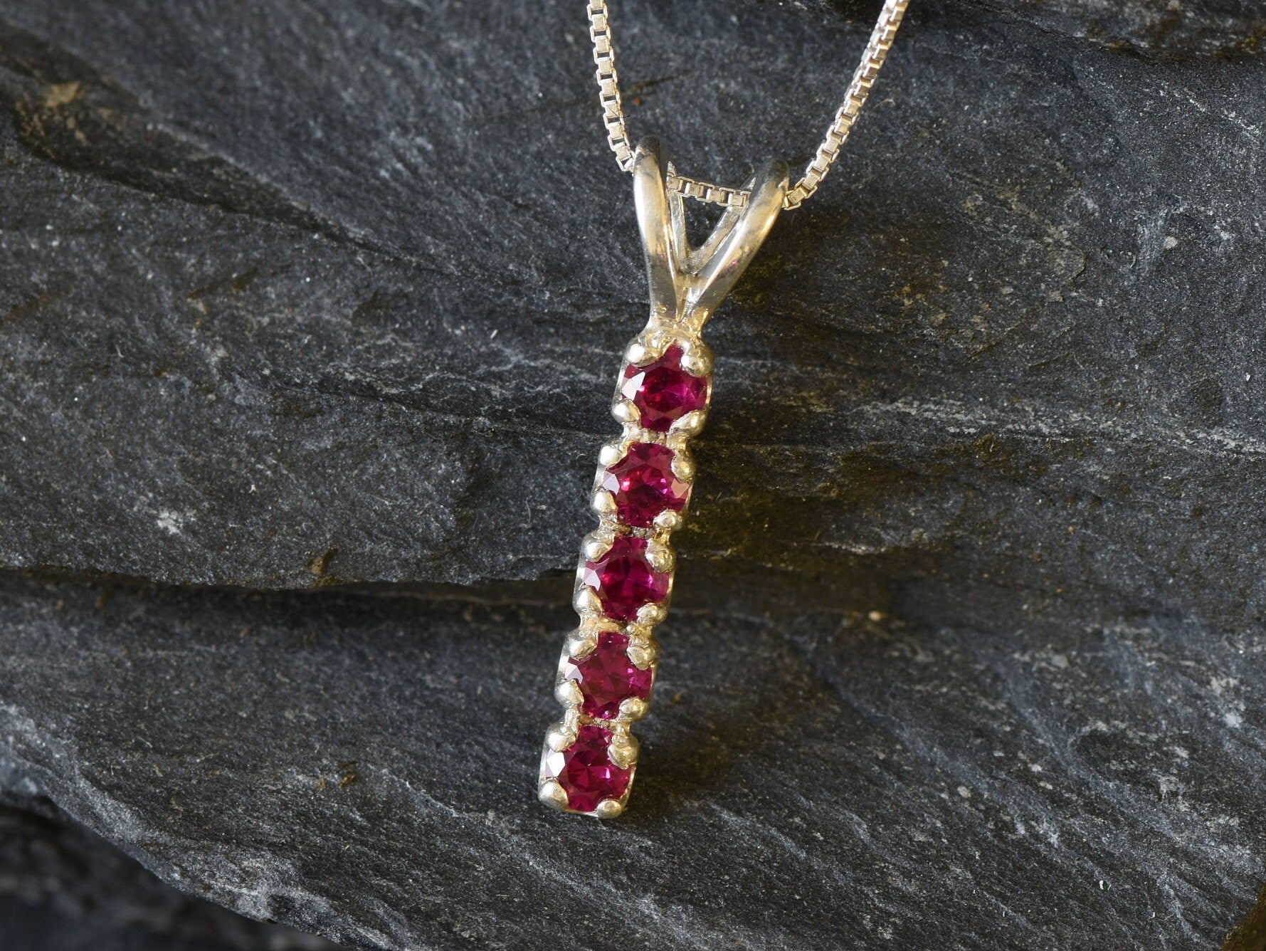 Elegant Ruby Pendant in 925 Sterling Silver, Channel-Set Round Created Red Ruby, perfect for birthdays and special occasions.
