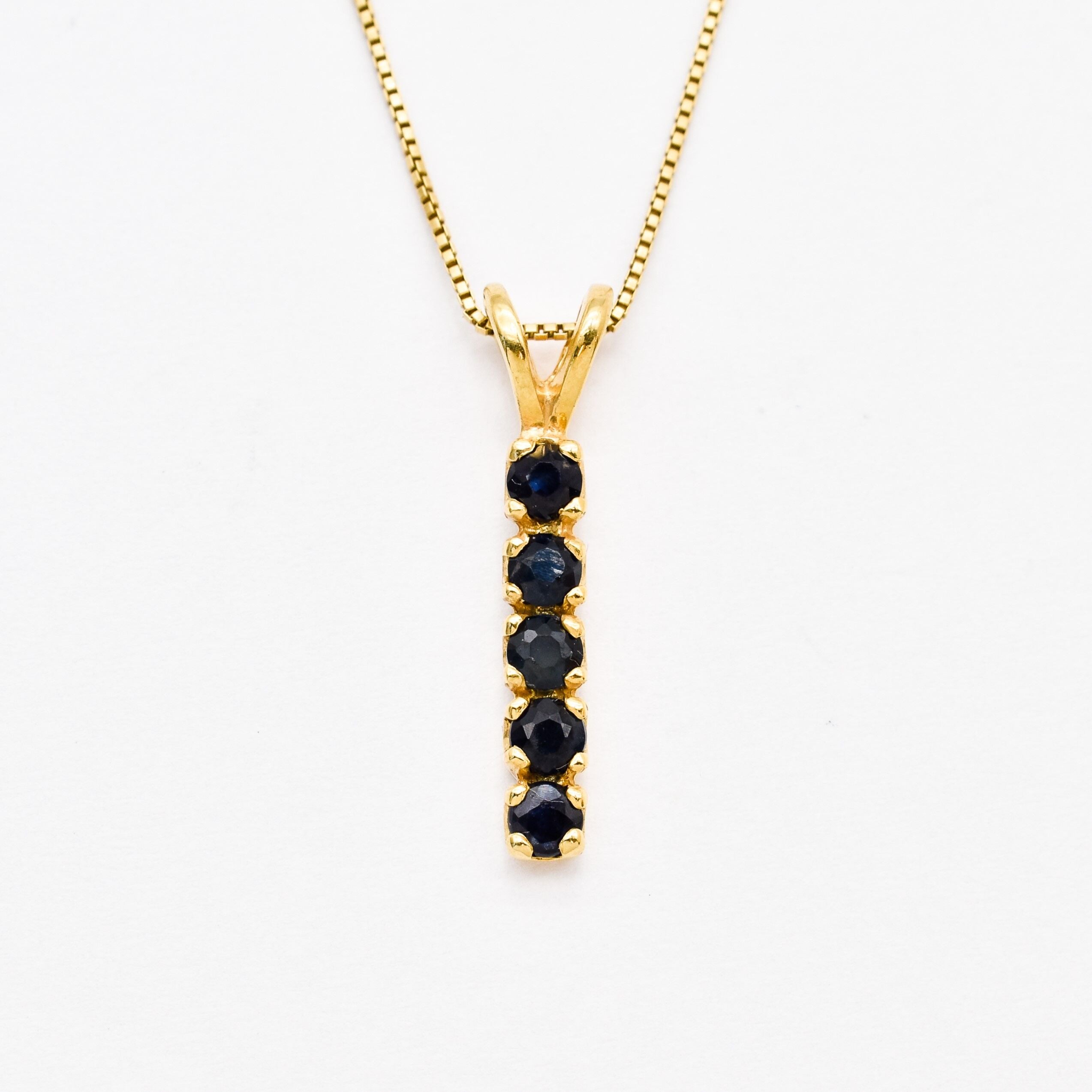 Created Sapphire Pendant made in 18k Gold Vermeil with Round Created Blue Sapphire in Channel-Set setting, September Birthstone gift idea, symbolizes sincerity, truth, and faithfulness, ideal for everyday wear and perfect for birthday gifting and special occasions.