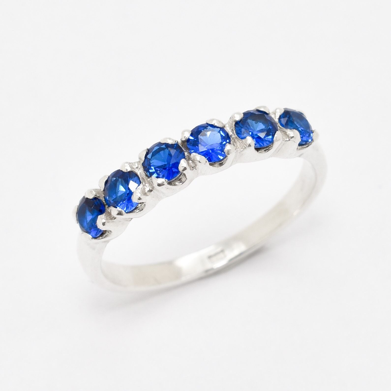 Created Sapphire Ring made in 925 Sterling Silver with Round Created Blue Sapphire in Channel-Set setting, September Birthstone gift idea, symbolizes sincerity, truth, and faithfulness, ideal for everyday wear and perfect for birthday gifting and special occasions.