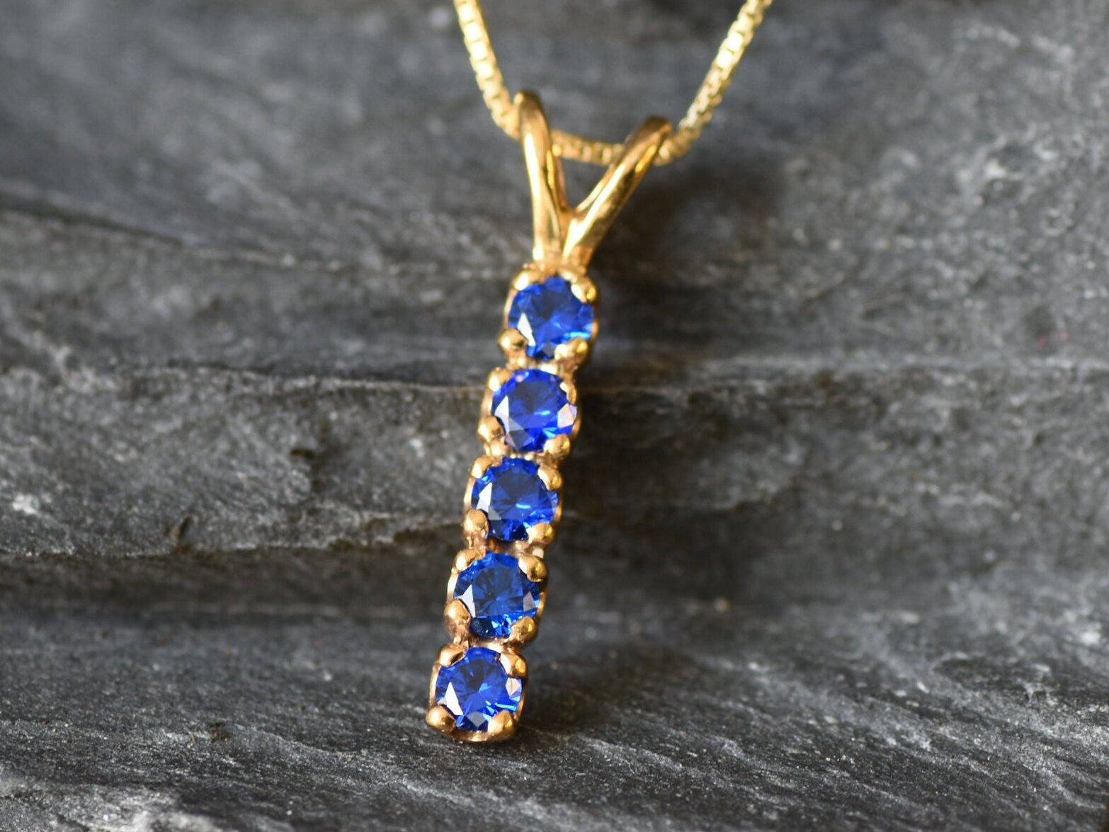Created Sapphire Pendant made in 18k Gold Vermeil with Round Created Blue Sapphire in Channel-Set setting, September Birthstone gift idea, symbolizes sincerity, truth, and faithfulness, ideal for everyday wear and perfect for birthday gifting and special occasions.