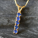 Created Sapphire Pendant made in 18k Gold Vermeil with Round Created Blue Sapphire in Channel-Set setting, September Birthstone gift idea, symbolizes sincerity, truth, and faithfulness, ideal for everyday wear and perfect for birthday gifting and special occasions.