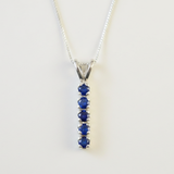 Created Sapphire Pendant made in 925 Sterling Silver with Round Created Blue Sapphire in Channel-Set setting, September Birthstone gift idea, symbolizes sincerity, truth, and faithfulness, ideal for everyday wear and perfect for birthday gifting and special occasions.