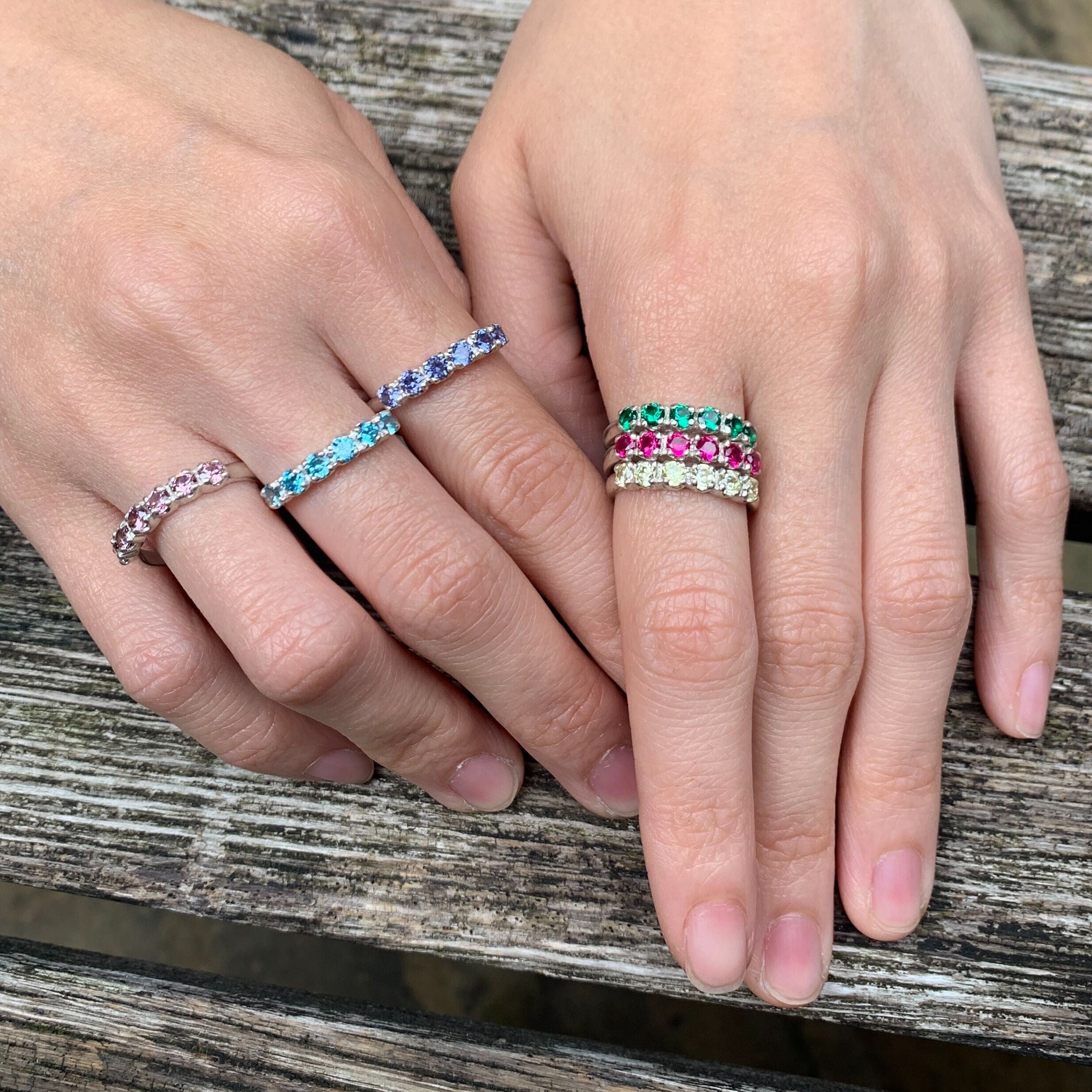 Elegant 925 Sterling Silver ring featuring a channel-set round Created Green Emerald, perfect for May birthdays and special occasions.