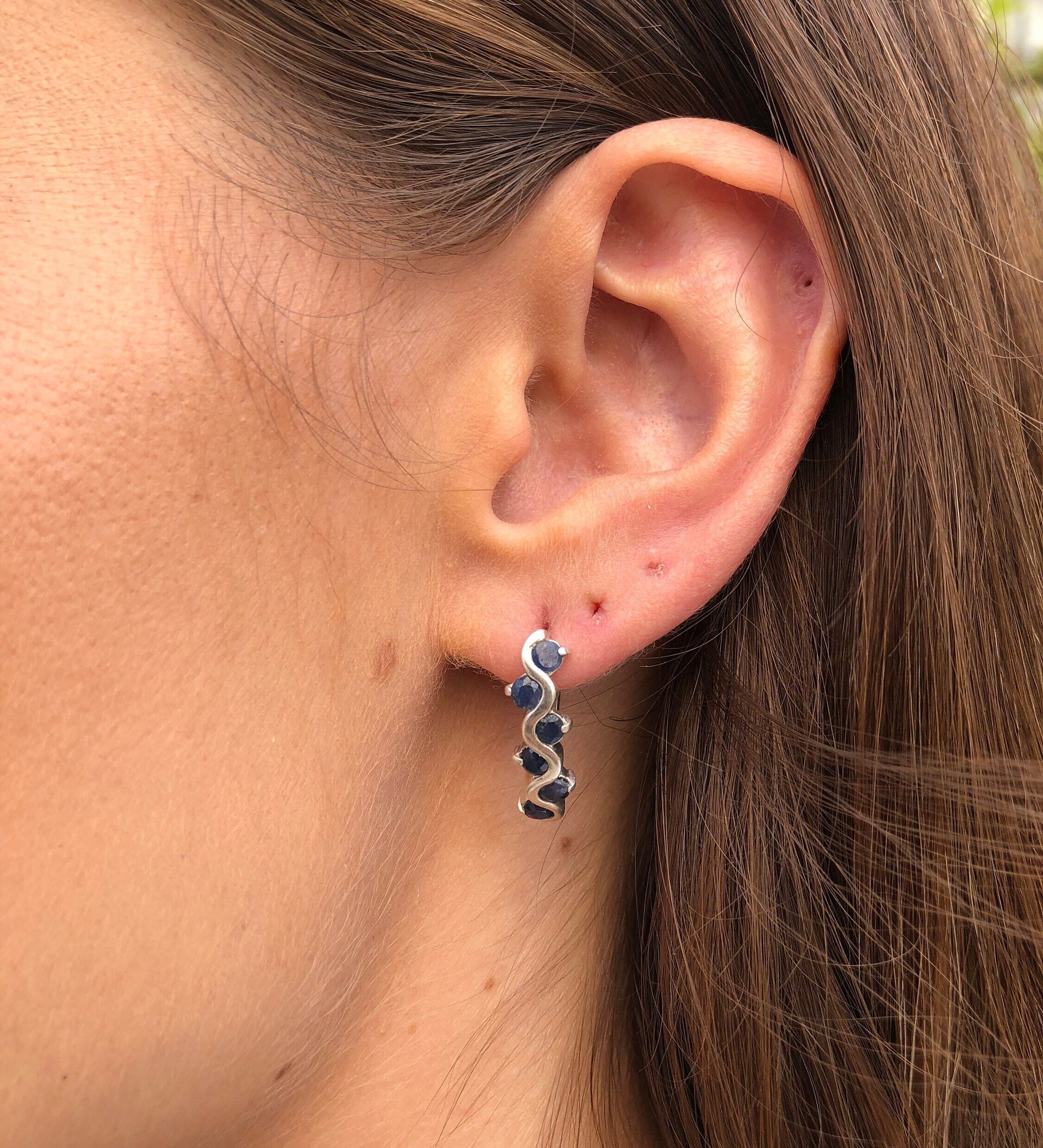 Elegant 925 Sterling Silver earrings featuring round Blue Sapphire, symbolizing sincerity; perfect for birthdays and special occasions.
