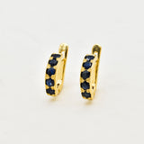 Gold Sapphire Huggies - Gold Hoop Earrings - Dainty Blue Hoops made in 18k Gold Vermeil. Ideal for everyday wear and perfect for birthday gifting and special occasions.