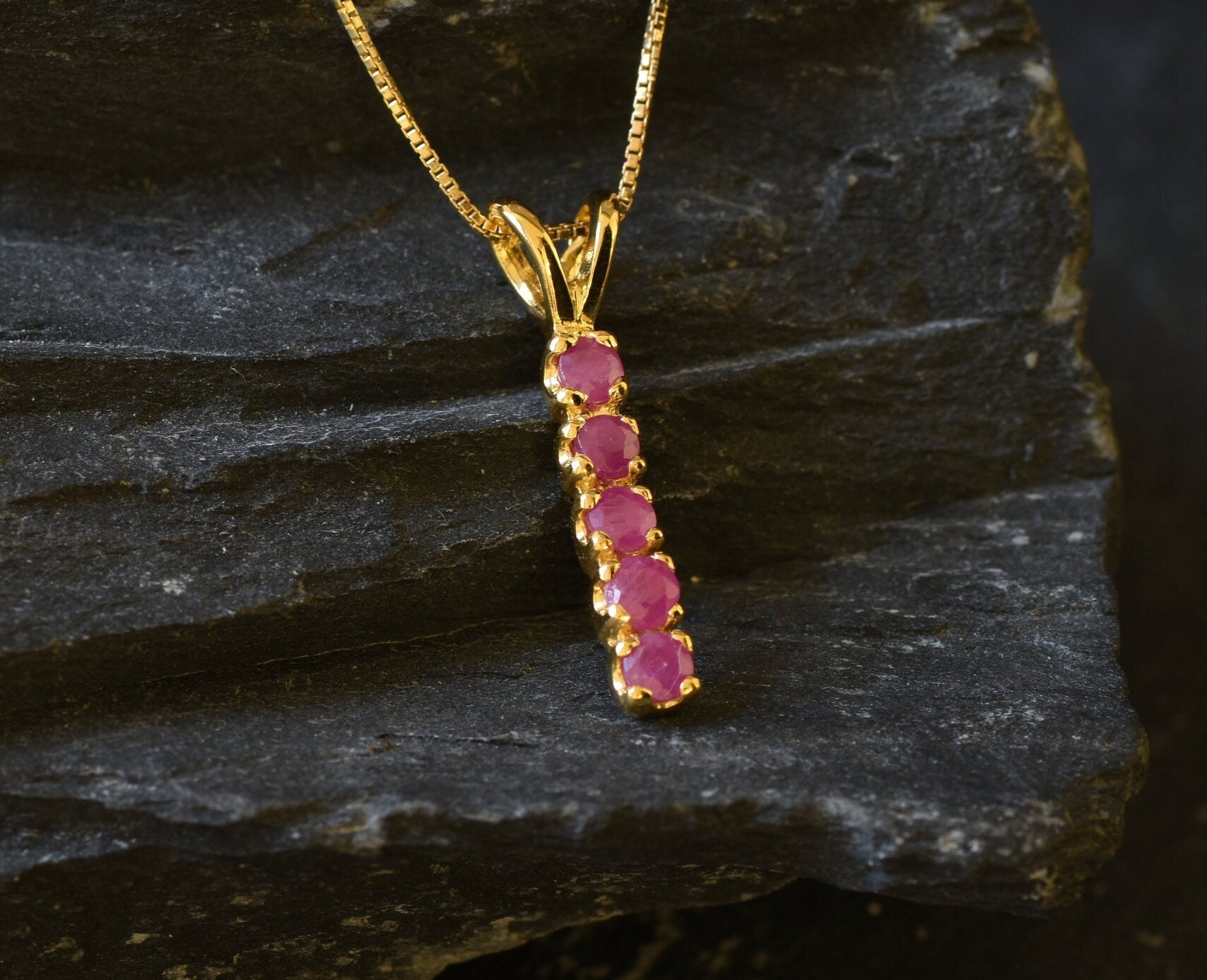 Elegant Natural Ruby Pendant in 18k Gold Vermeil, showcasing a vibrant red ruby, a timeless gift for any celebration.