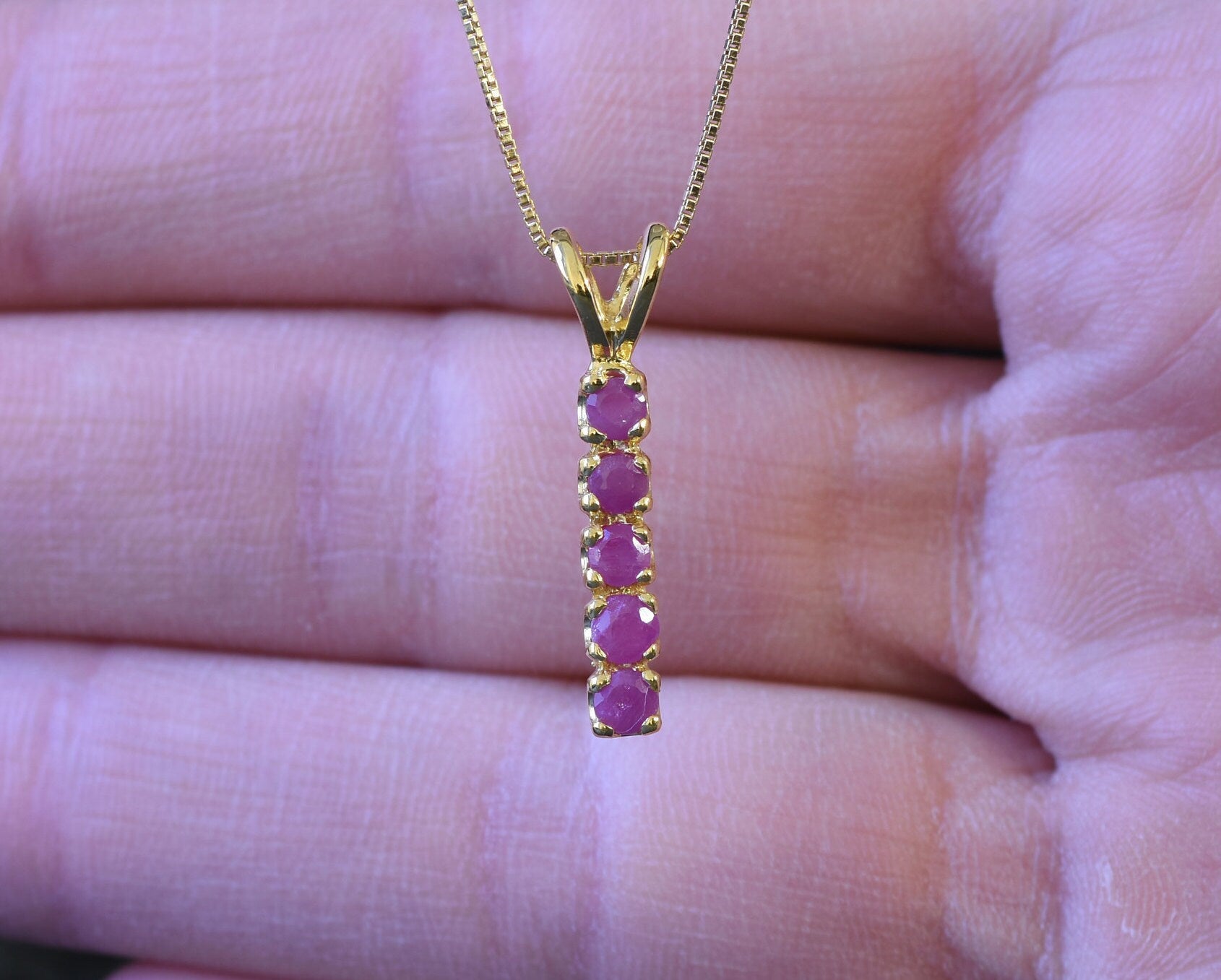 Lovely Ruby Pendant in 18k Gold Vermeil, beautifully channel-set, perfect for celebrating July birthdays with elegance.