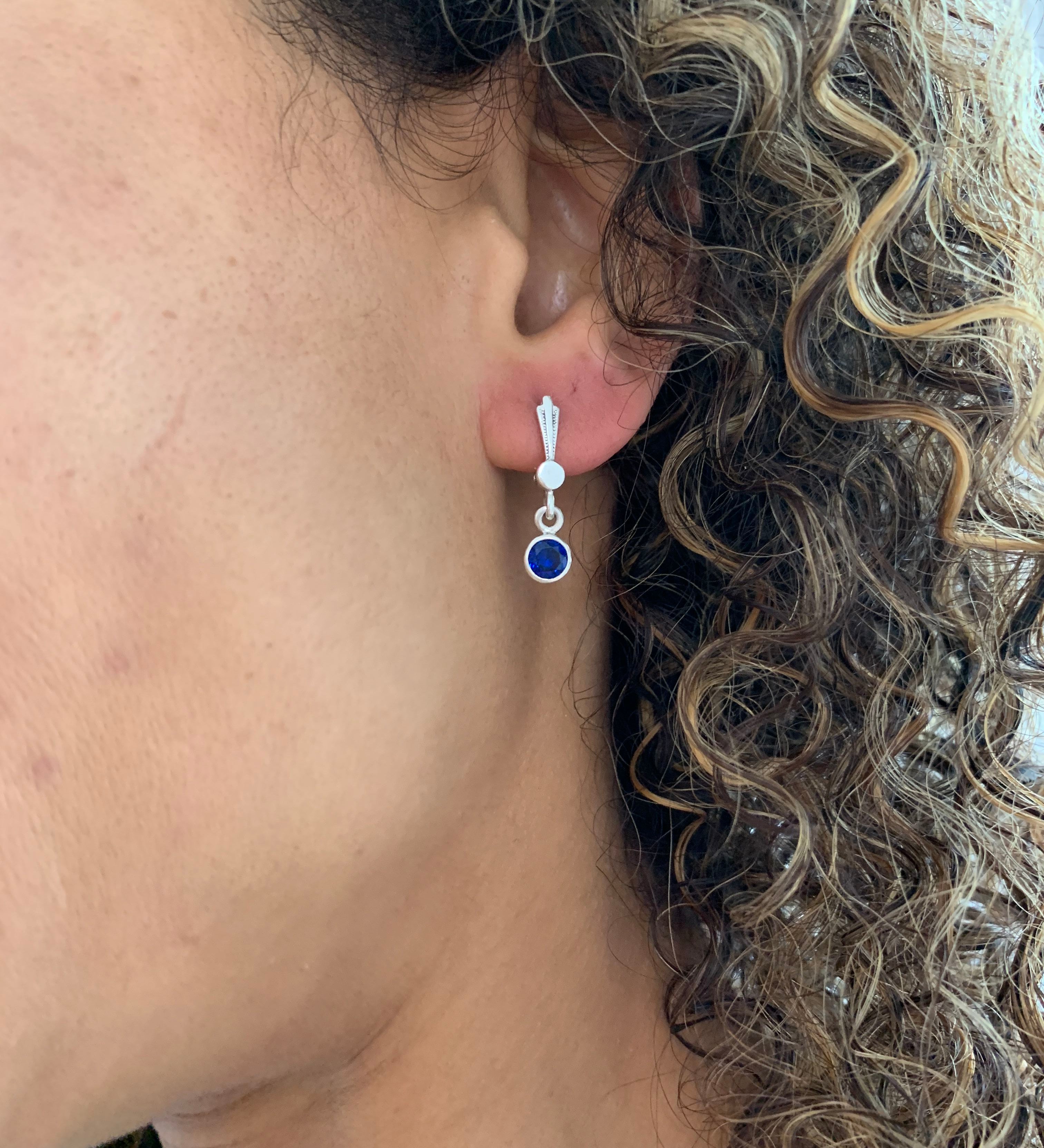 Elegant 925 Sterling Silver Ruby Earrings, featuring natural red rubies in a stylish bezel setting, perfect for any occasion.