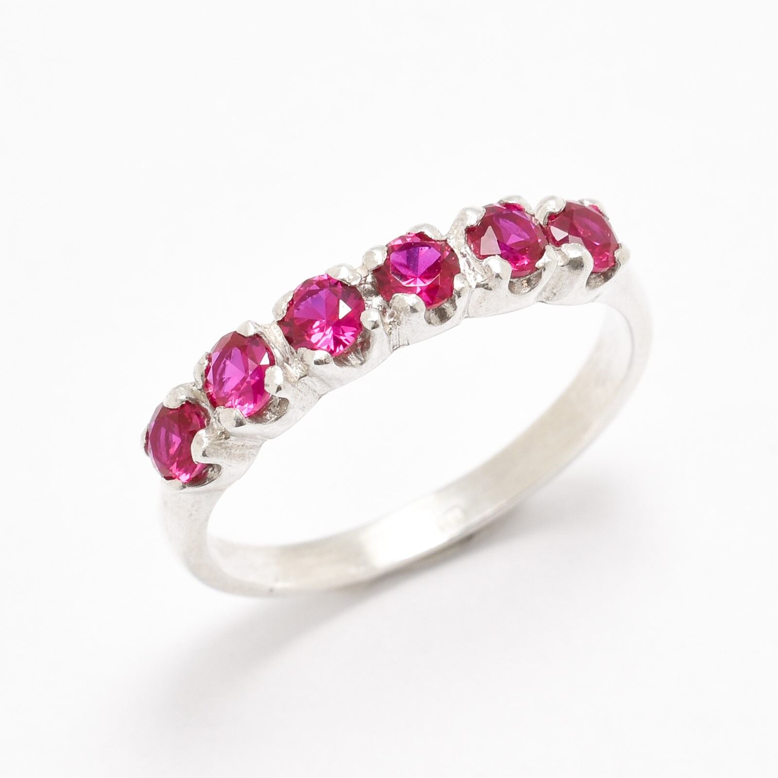 Created Ruby Ring made in 925 Sterling Silver with Round Created Red Ruby in Channel-Set setting, July Birthstone gift idea, symbolizes nobility, purity, and passion, ideal for everyday wear and perfect for birthday gifting and special occasions.