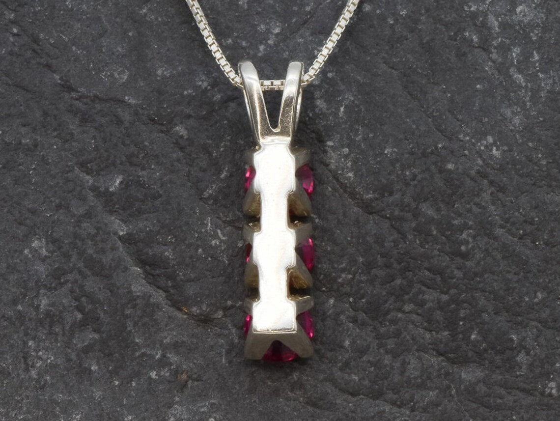 Gorgeous Created Ruby Pendant in 925 Sterling Silver, a chic three-stone design perfect for celebrating July birthdays and special moments.