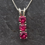 Created Ruby Pendant made in 925 Sterling Silver with Round Created Red Ruby in Three-Stone setting, July Birthstone gift idea, symbolizes nobility, purity, and passion, ideal for everyday wear and perfect for birthday gifting and special occasions.