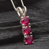 Elegant Created Ruby Pendant in 925 Sterling Silver, showcases a vibrant red stone, a meaningful gift for July birthdays.