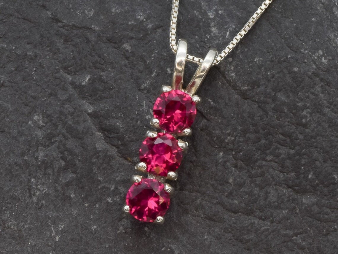Stunning 925 Sterling Silver Created Ruby Pendant, featuring a three-stone design, ideal for everyday elegance and July birthdays.