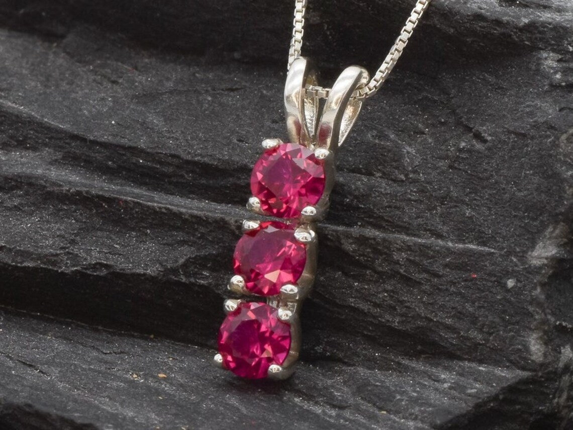 Charming Created Ruby Pendant in 925 Sterling Silver, a timeless gift reflecting passion, perfect for everyday elegance and July celebrations.