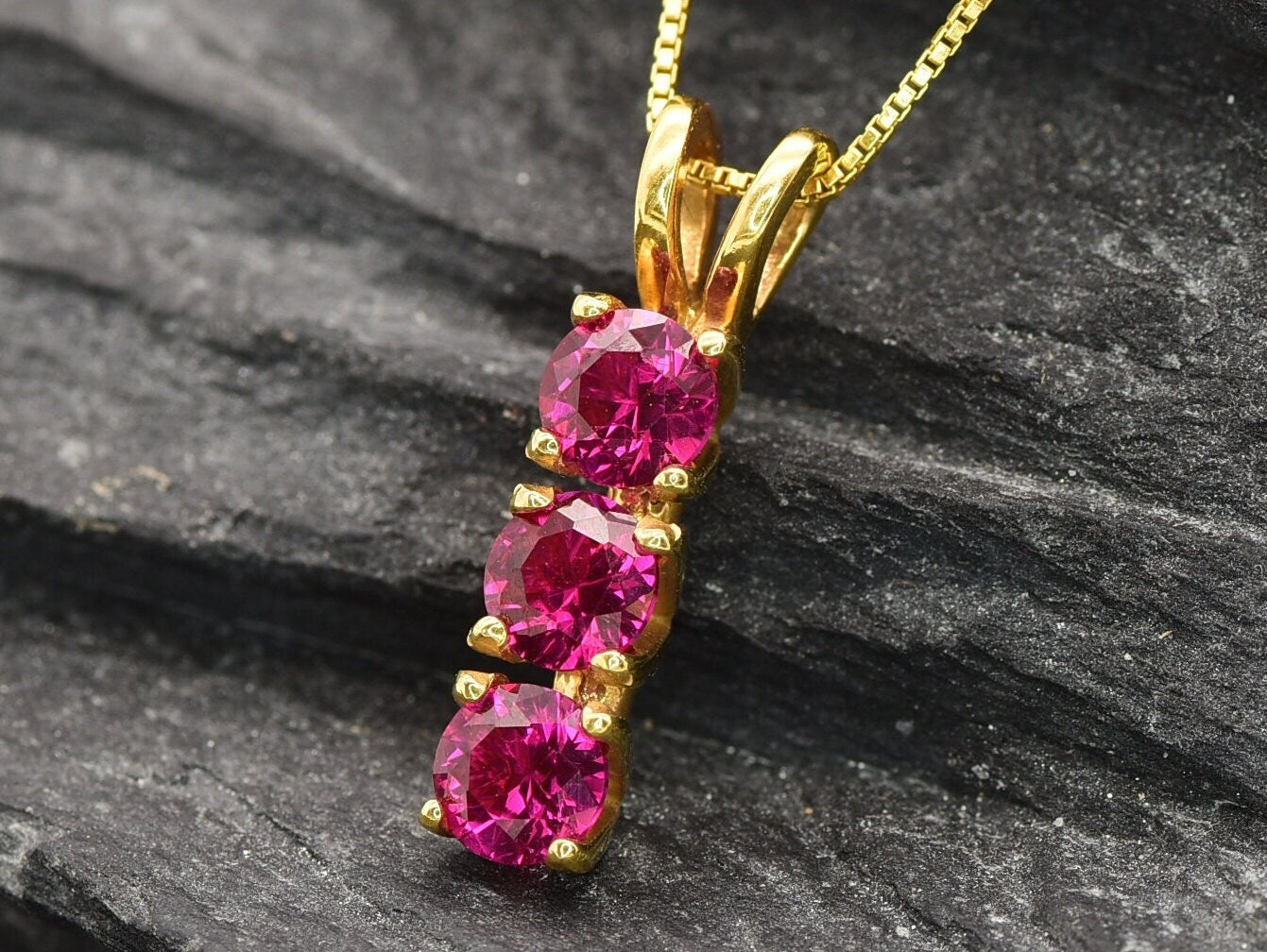 Created Ruby Pendant made in 18k Gold Vermeil with Round Created Red Ruby in Three-Stone setting, July Birthstone gift idea, symbolizes nobility, purity, and passion, ideal for everyday wear and perfect for birthday gifting and special occasions.