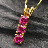 Created Ruby Pendant made in 18k Gold Vermeil with Round Created Red Ruby in Three-Stone setting, July Birthstone gift idea, symbolizes nobility, purity, and passion, ideal for everyday wear and perfect for birthday gifting and special occasions.