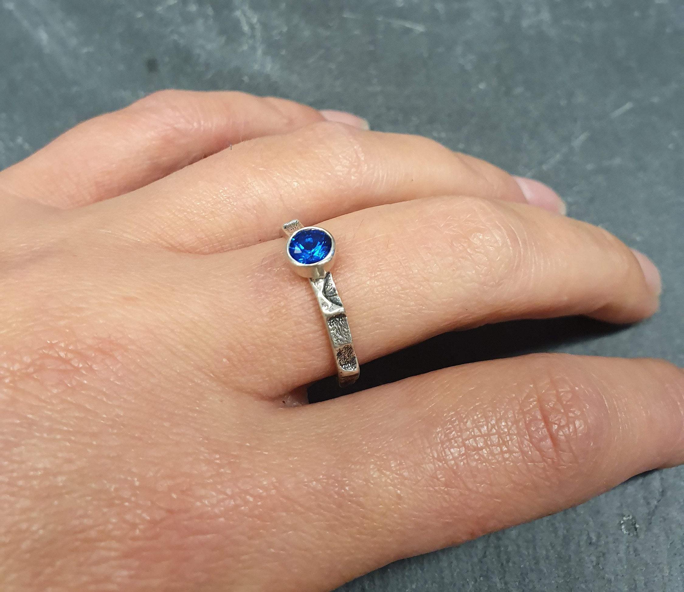 Elegant 925 Sterling Silver ring featuring a Round Created Blue Sapphire, perfect for birthdays and special occasions.