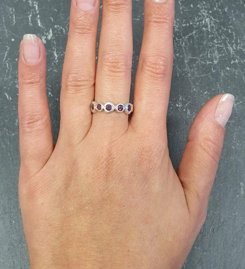 Elegant 925 Sterling Silver ring featuring a round Created Red Ruby, perfect for July birthdays and special occasions.