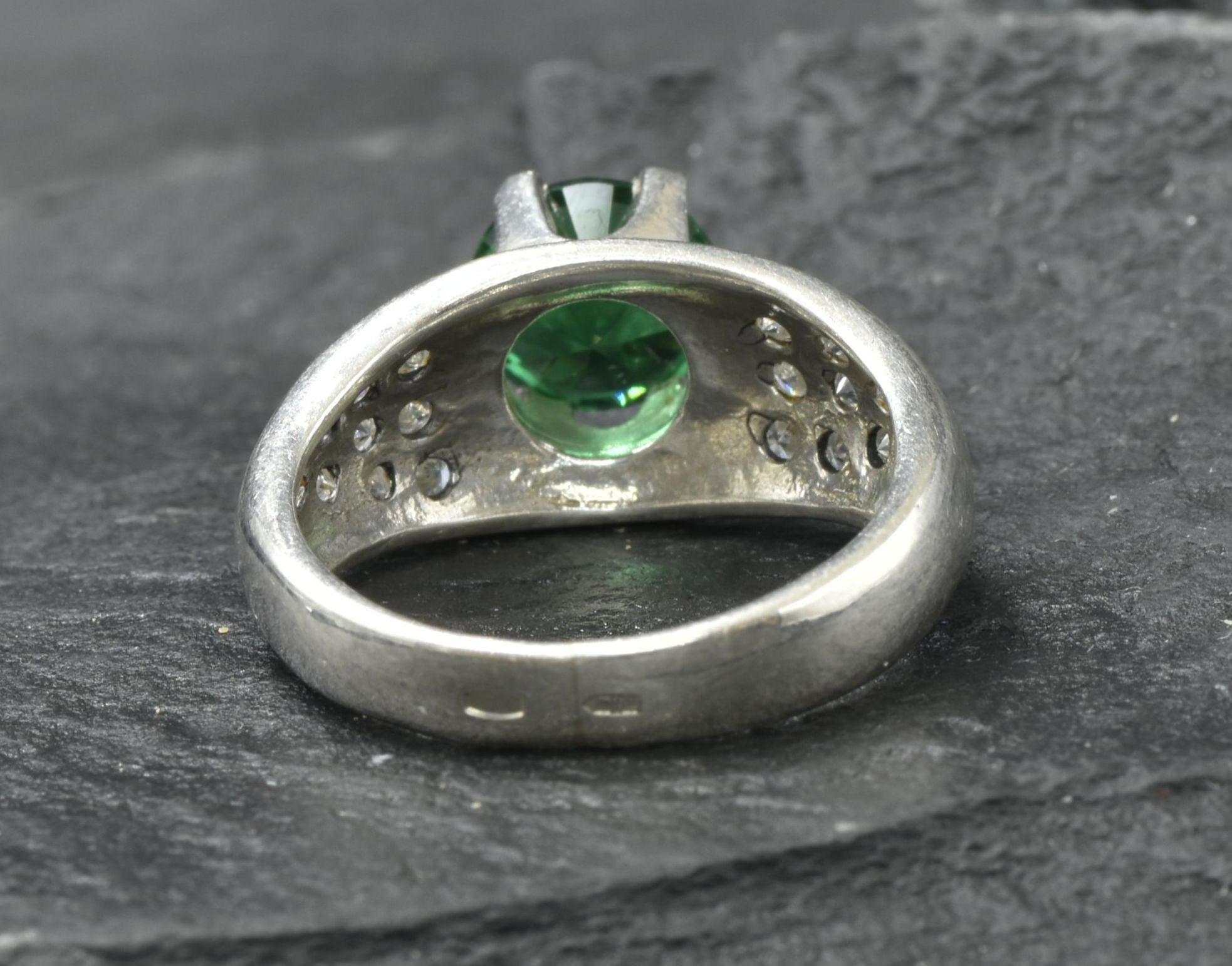 Exquisite 925 Sterling Silver ring featuring a radiant round created green emerald in a cluster setting, perfect for any occasion.