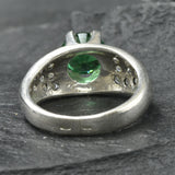 Exquisite 925 Sterling Silver ring featuring a radiant round created green emerald in a cluster setting, perfect for any occasion.