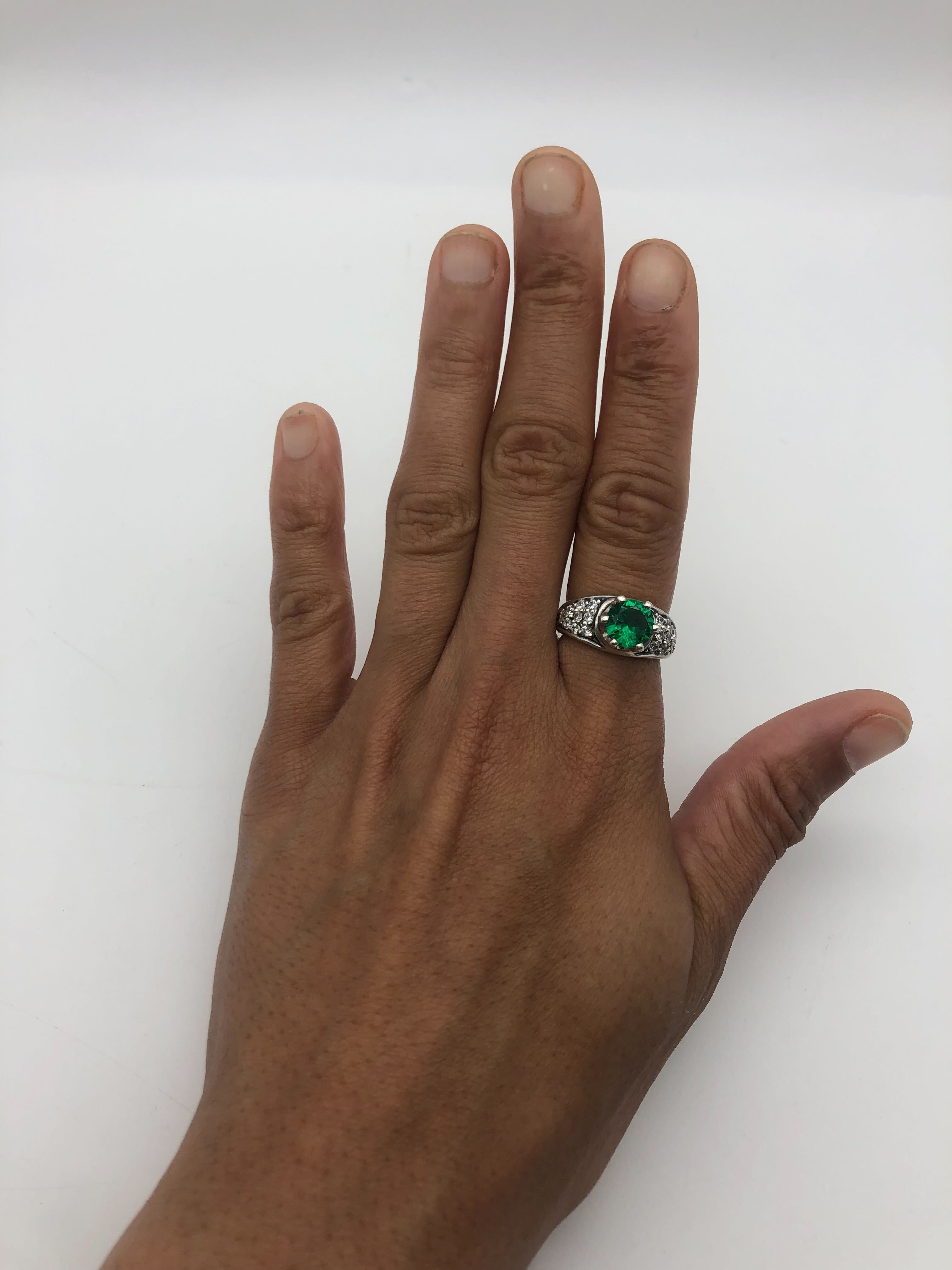 Charming 925 Sterling Silver ring showcasing a round created green emerald in a lovely cluster design, perfect for gifting.