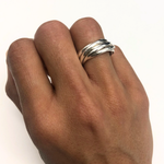Five intertwined strands create a stunning design in this 925 Sterling Silver rolling ring, perfect for daily wear.