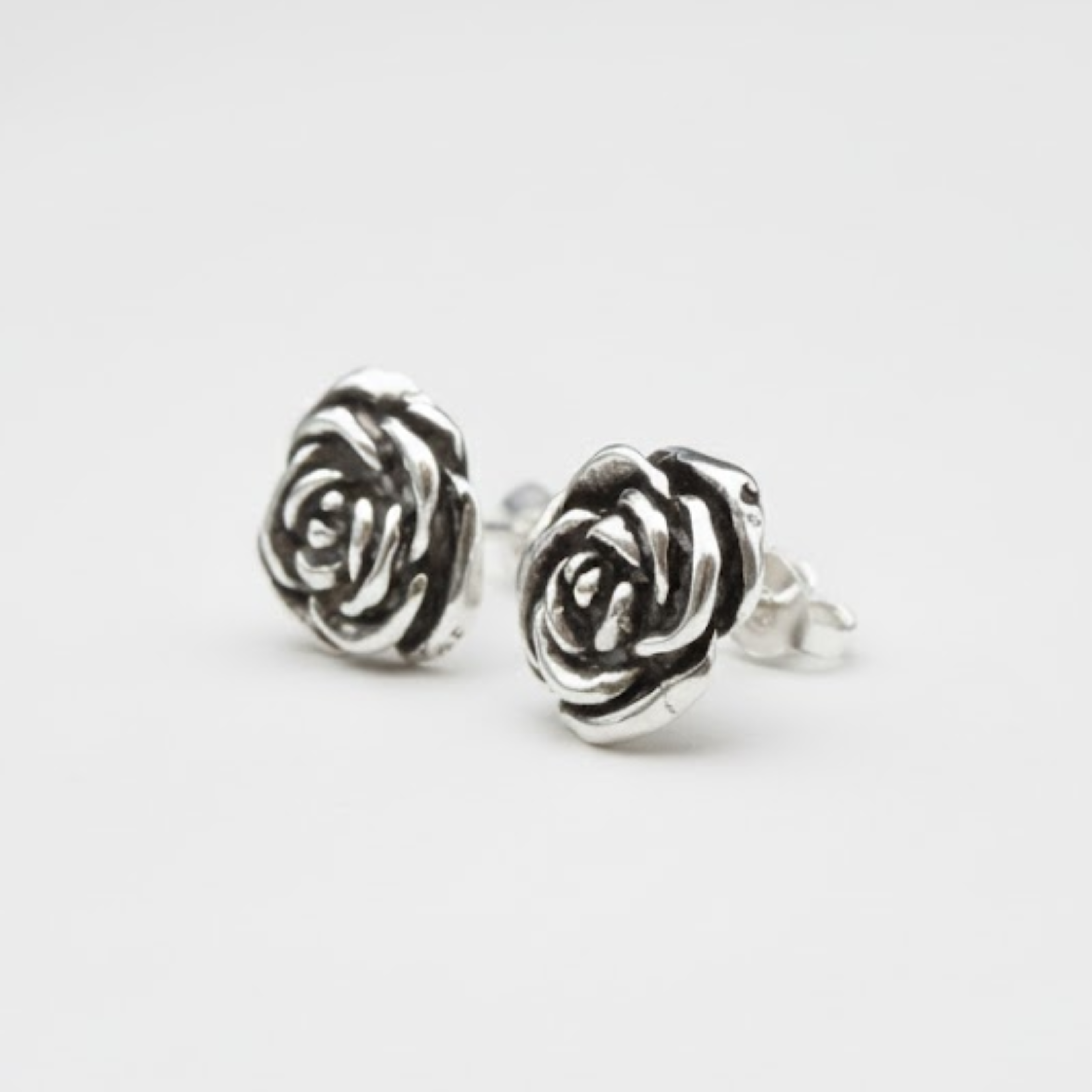 Charming Silver Flower Studs - Delicate 925 Sterling Silver roses, ideal for everyday style and special event celebrations.