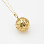 Stunning Gold Sphere Pendant adorned with the Flower of Life, perfect for daily wear and exceptional gift-giving moments.