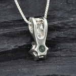 Charming emerald pendant in 925 sterling silver, features a vibrant green stone, a delightful gift for May birthdays and special events.