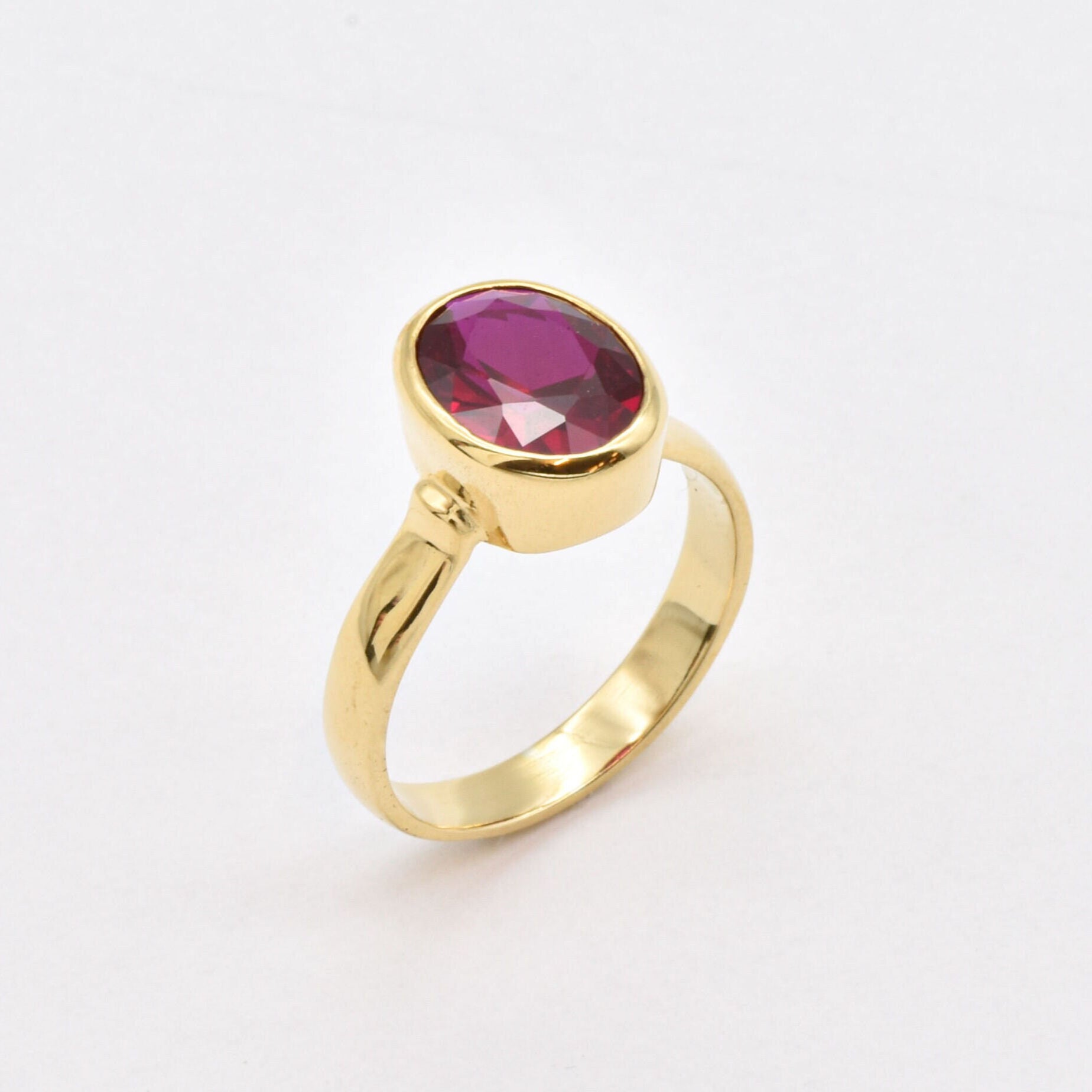 Stunning 18k gold vermeil ring with an exquisite oval created red ruby, a meaningful gift for July birthdays and celebrations.