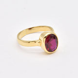 Chic 18k gold vermeil ring set with a brilliant oval created red ruby, embodying passion and elegance for any occasion.