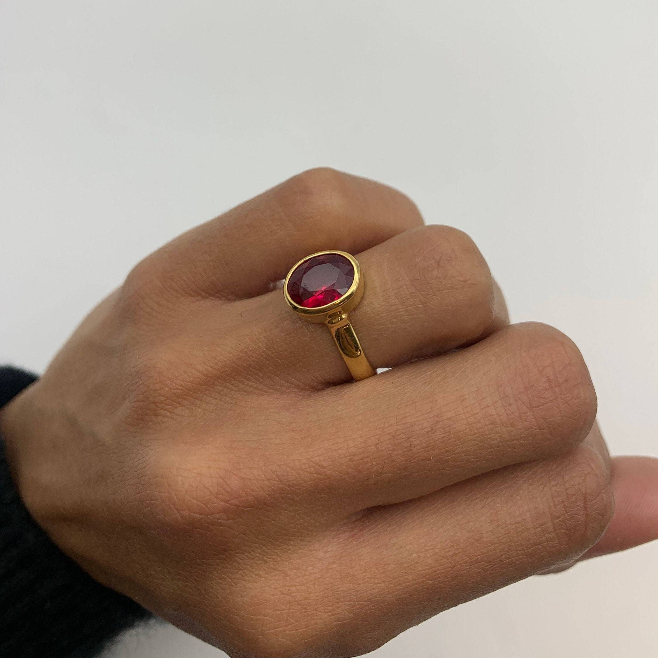 Beautiful 18k gold vermeil ring featuring a vibrant oval created red ruby, an ideal gift for July birthdays and elegant wear.